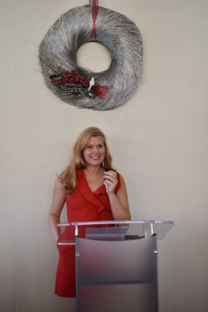 heather speaking at holiday luncheon.jpg